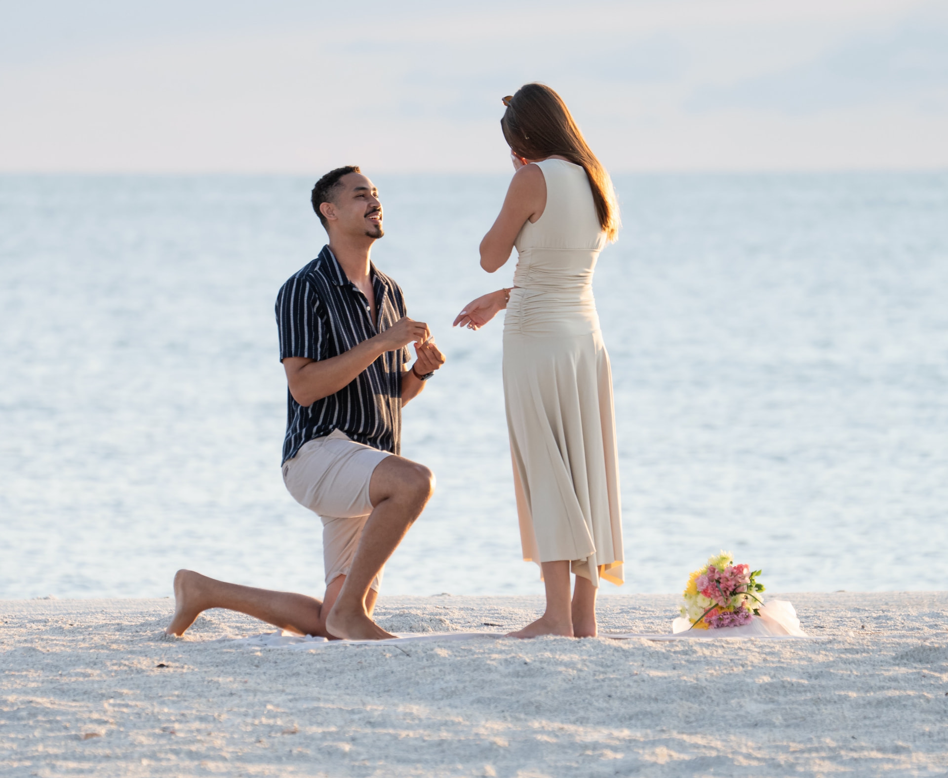 Surprise beach proposal photographed at sunset on Marco Island